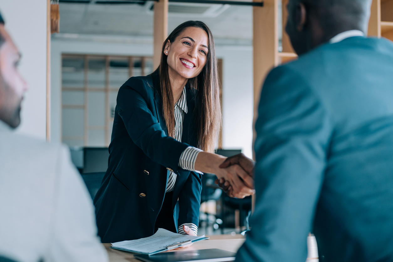 executives of CCBHC shaking hands