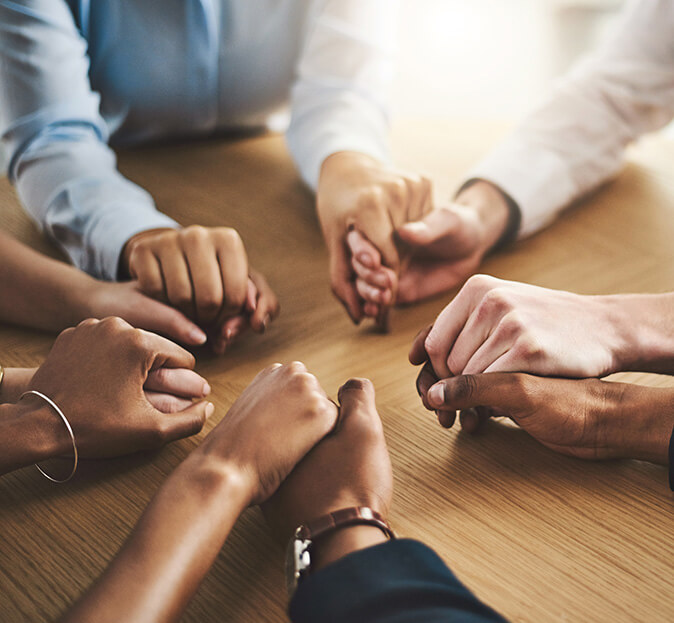 multiple women holding hands