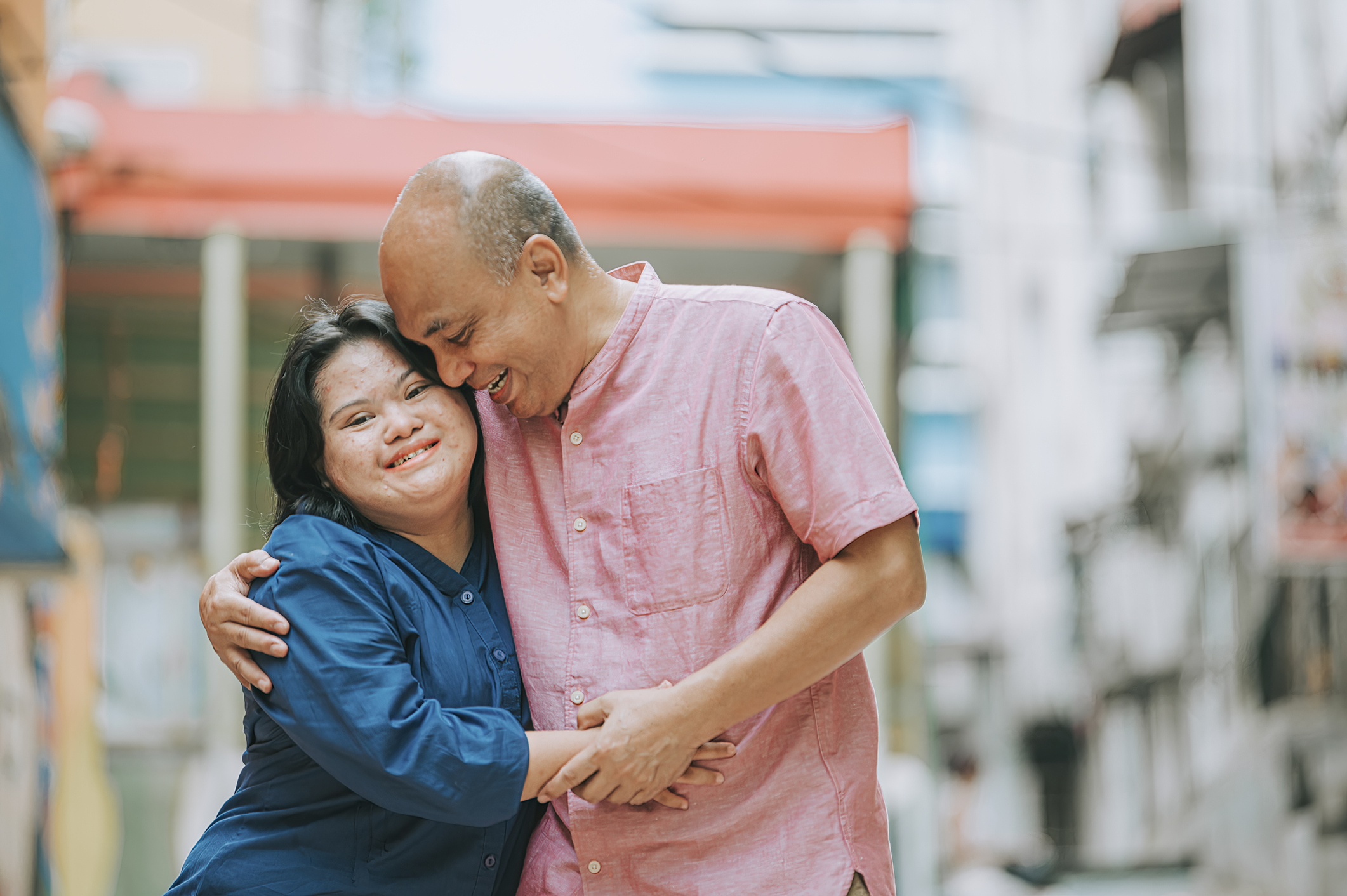 female with I/DD bonding with her father in city street