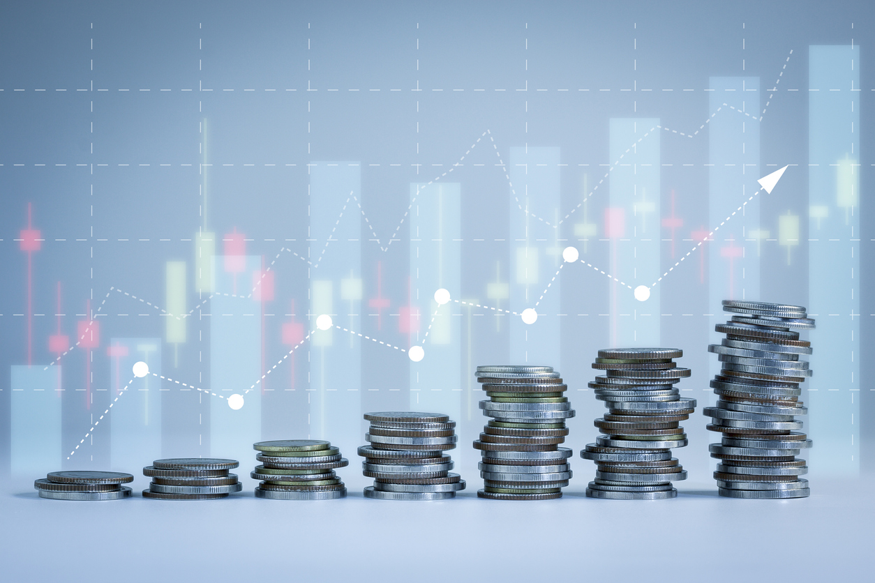 Stacking of money coins in a chartx showing growth with revenue cycle management services