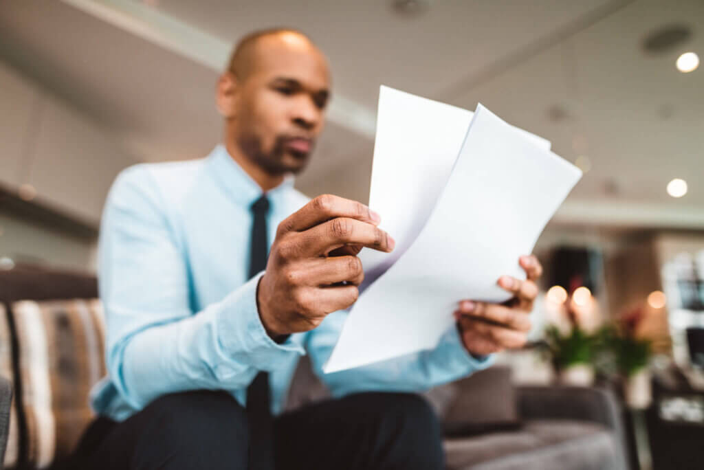 mental health professional reading documents about the CCBHC criteria