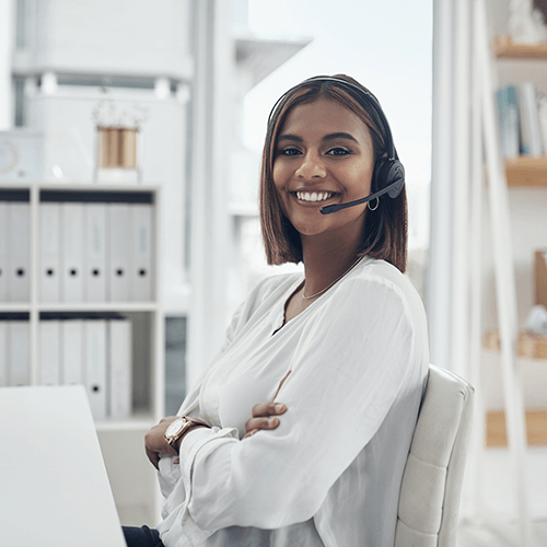 A woman smiling in a headset