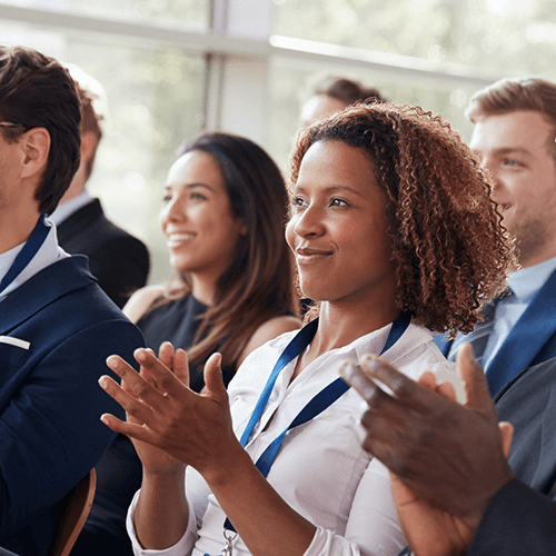 A group of people clapping