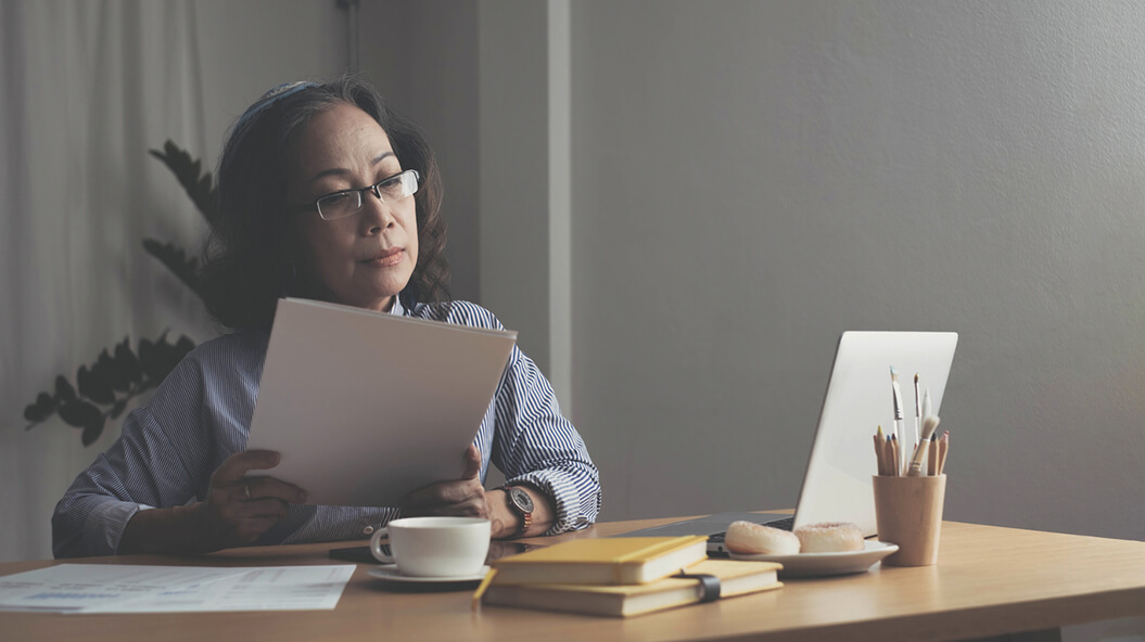 A woman examining papers
