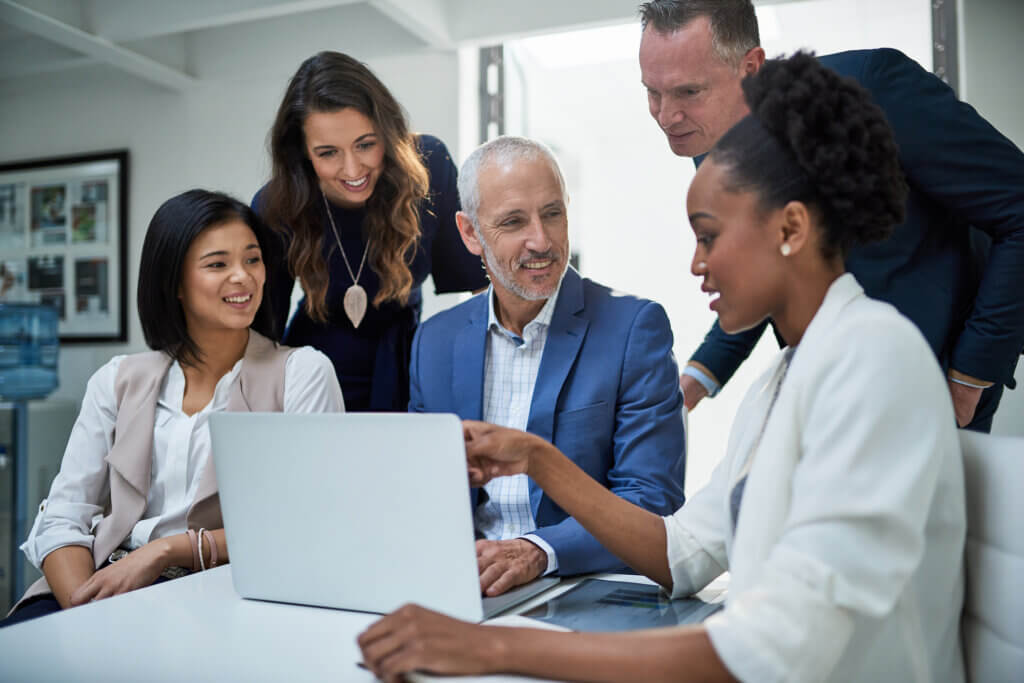 Group of Behavioral Health Professionals working on a computer using their Behavioral Health EHR