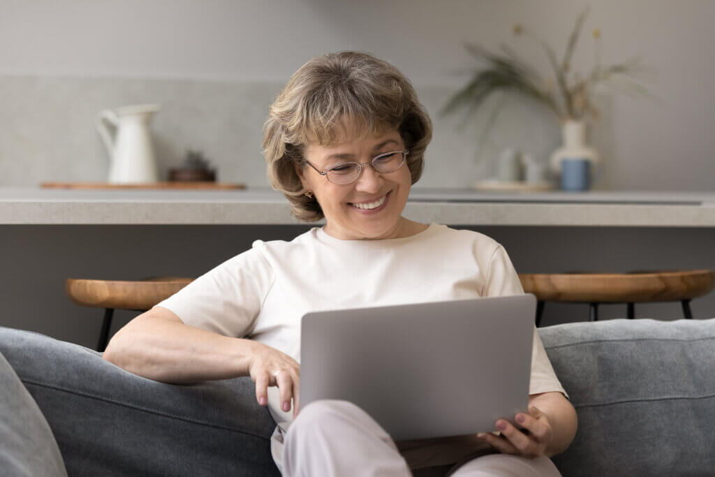 woman viewing telehealth appointment on computer