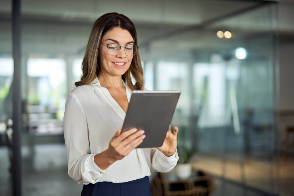 woman looking at tablet