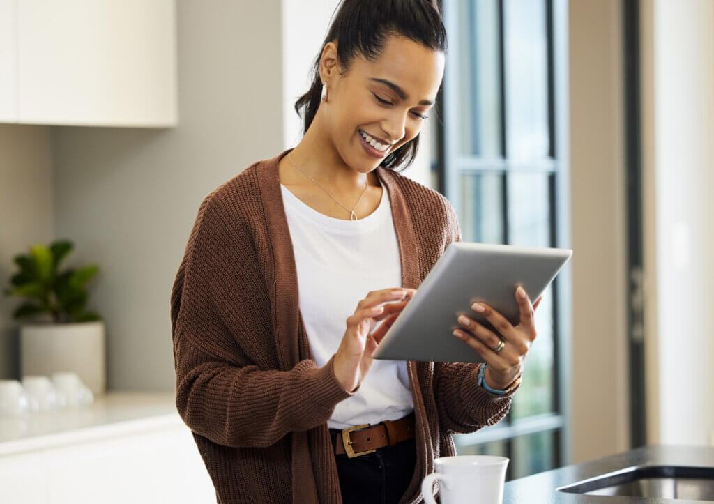 woman looking at tablet for virtual care appointment