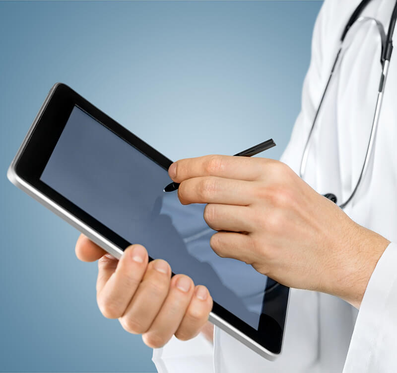 doctor checking notifiactions on interoperable ehr software mobile device